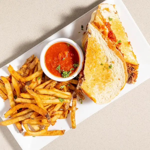 Chicken parmesan panini with fries
