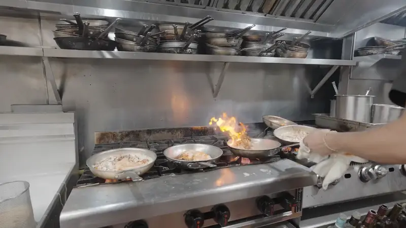 Flames rising in the Giardino's kitchen
